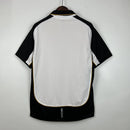 Camisa Dupla Face Retrô Manchester United Umbro 2001/02 100 Anos Masculina Branca e Preta ou Dourada - MAJESTO BR